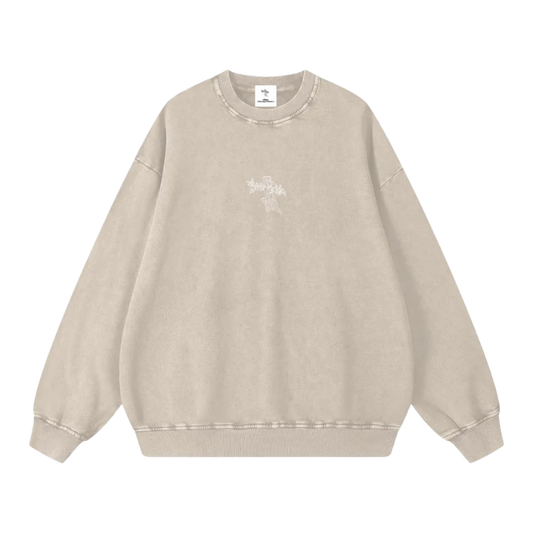 Beige sweatshirt with a small graphic on a white background