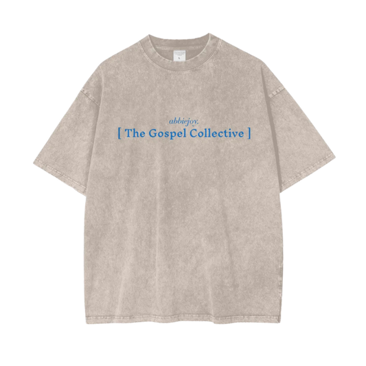Beige t-shirt with blue text on a white background