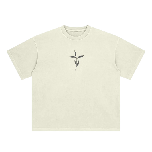 Beige t-shirt with a black leaf design on a white background
