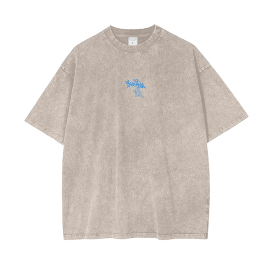 Beige t-shirt with a small blue logo on a white background