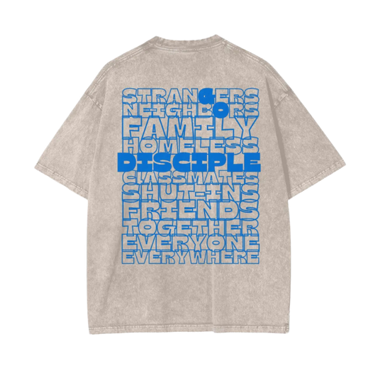 Beige t-shirt with blue text on the back on a white background
