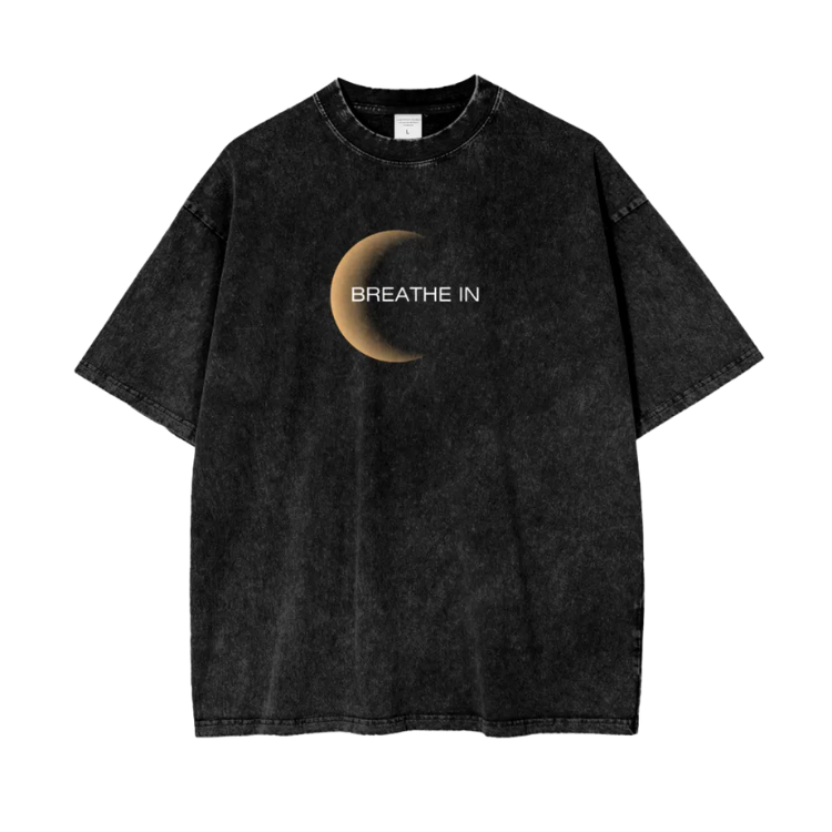 Black t-shirt with a moon graphic and 'Breathe In' text on a white background