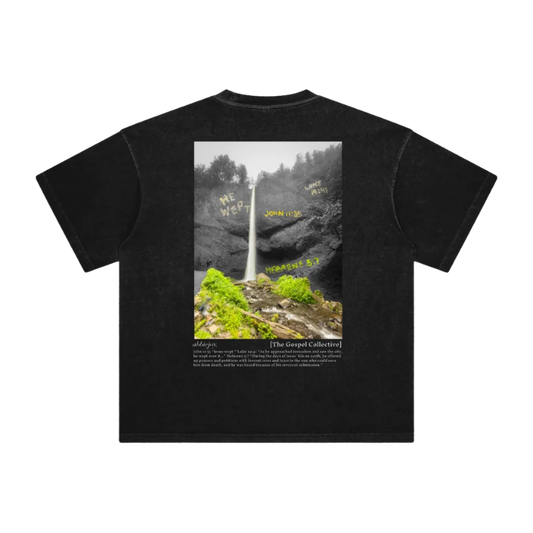Black t-shirt with a graphic of a waterfall and text on a white background