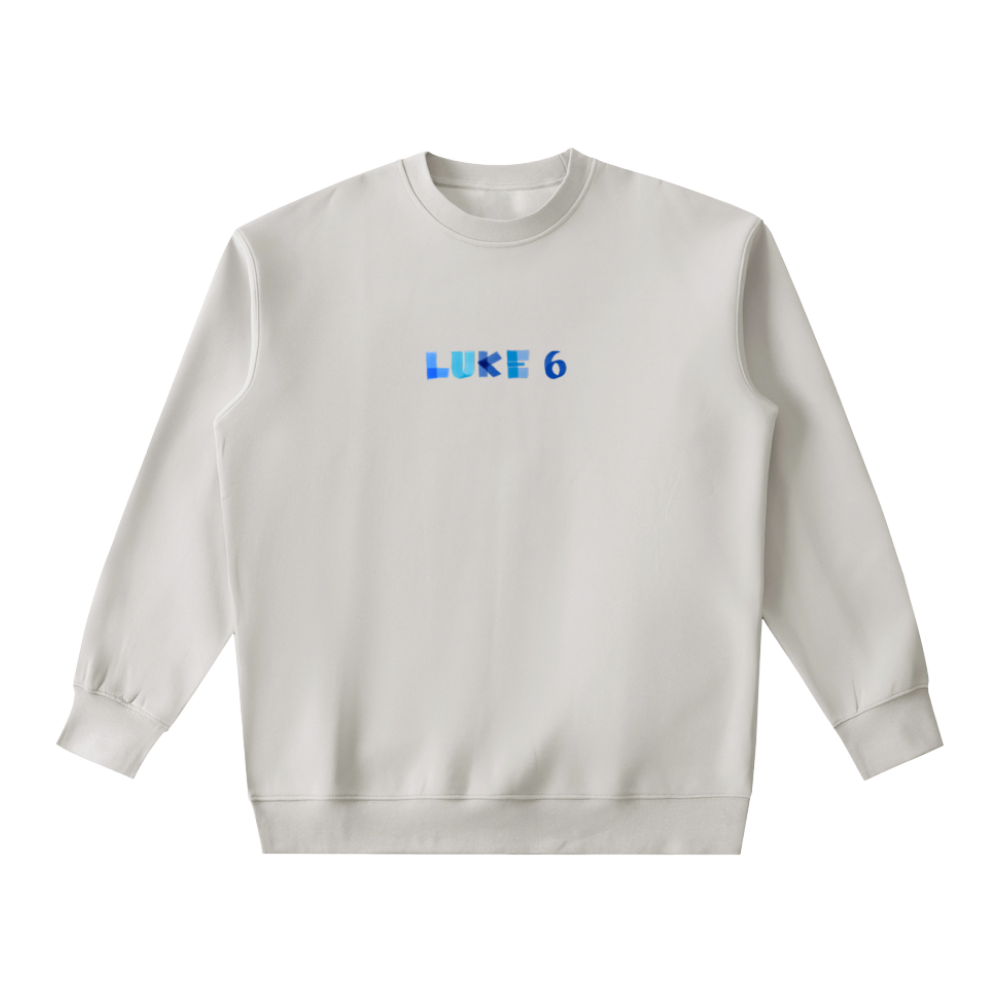 White sweatshirt with 'LUKE 6' printed on it against a white background