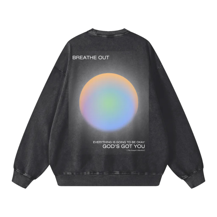Black sweatshirt with a colorful circular design and text on the back against a white background