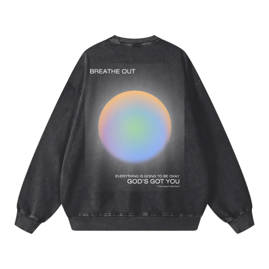 Black sweatshirt with a colorful circular design and text on the back against a white background