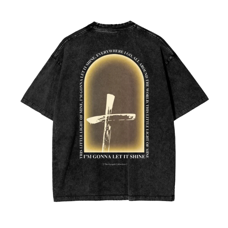Black t-shirt with a cross design and text on the back against a white background