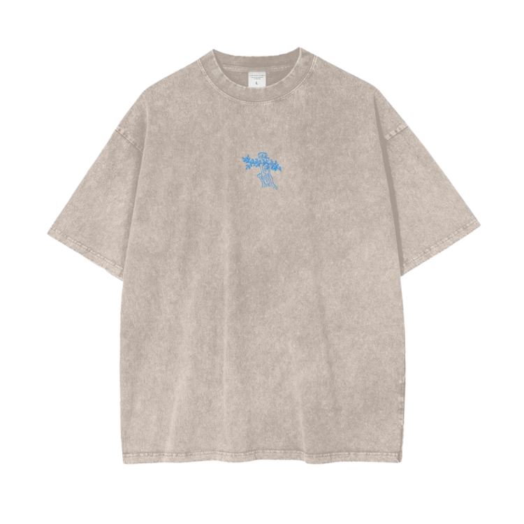 Beige t-shirt with a small blue logo on a white background